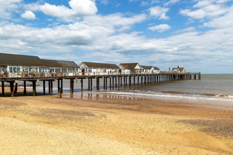 Sandy beach and pier, Southwold, Suffolk, England, UK