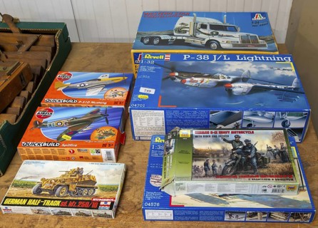 Boxes of Revell and Airfix military vehicles and planes scale models on display at auction, UK