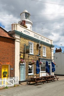 The Sole Bay Inn, historic Adnams public house next to lighthouse, Southwold, Suffolk, England, UK