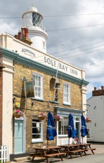 The Sole Bay Inn, historic Adnams public house next to lighthouse, Southwold, Suffolk, England, UK