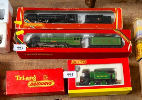 Model railway toy train set items on display for sale at auction room, UK
