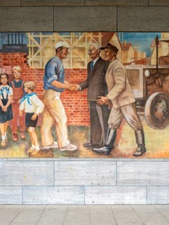 Close-up of the GDR-era Max Lingner propaganda mural, Detlev Rohwedder House, Berlin, Germany