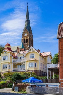 Church (Lysekils kyrka) and section of the house front at the south harbour, Lysekil, BohuslÃ¤n,