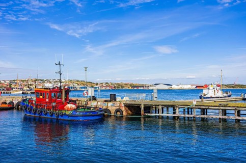 Picturesque scenery of small tugboats in the harbour of Lysekil, BohuslÃ¤n, VÃ¤stra Götalands lÃ¤n,
