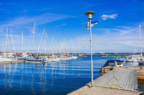 Picturesque scenery of sailing boats in the marina on the waterfront in the harbour of Lysekil,