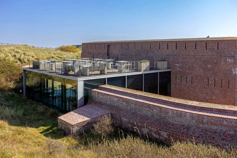 Restaurant with terrace at Fort Napoleon, polygonal fort of the Napoleonic era in the dunes at