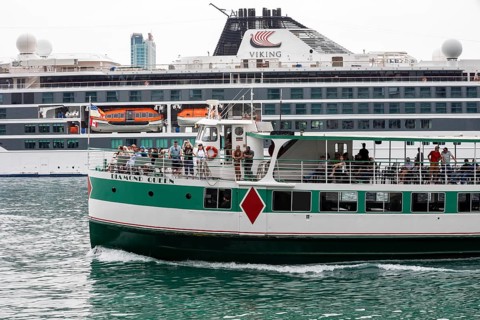 Detroit, Michigan - The sightseeing ship Diamond Queen passes the Viking Octantis luxury cruise