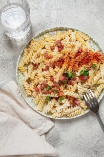 Fusilli pasta with cheese and bacon, homemade, no people