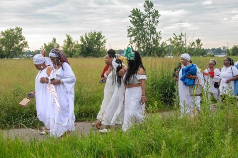 Detroit, Michigan - African-Americans gather on the banks of the Detroit River to commemorate