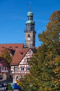 St. John's Church tower, historic half-timbered house in front, Lauf an der Pegnitz, Middle