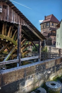 Waterwheel of the historic Schleifmühle, behind the Judenturm, built in 1430, former part of the
