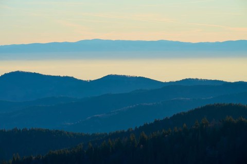 Blue-tinted mountain landscape in morning haze with calm colors, view of the Rhine Valley, Hohneck,