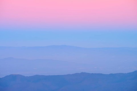 Rolling hills under a pink and blue sky at sunset, looking towards the Rhine Valley, Hohneck, La