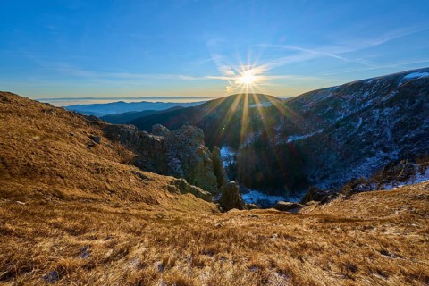 Intense sunshine over an extensive mountain range, clear and cool atmosphere, view of the Rhine