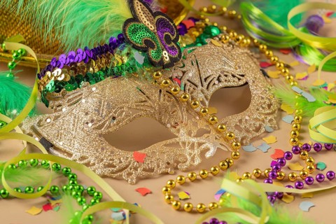 Golden carnival mask, colorful beads and confetti, carnival