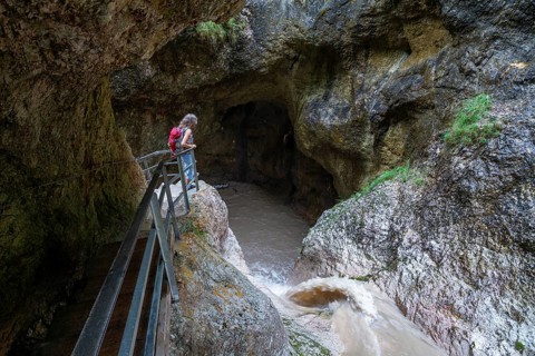 Woman hiking in the Almbach Gorge, Berchtesgaden Biosphere Reserve, Almbach, Berchtesgaden Alps,