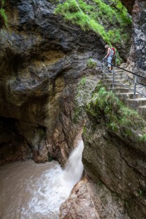 Woman hiking in the Almbach Gorge, Berchtesgaden Biosphere Reserve, Almbach, Berchtesgaden Alps,