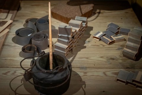 Matchboxes are glued together while working from home, historical scene, Tändsticksmuseet match