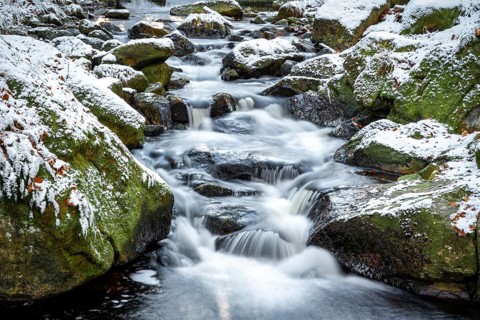 Lower Ilse Falls with snow and moss covered rocks in winter, Heinrich-Heine-Weg, Ilsetal, Harz