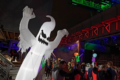 Illuminated ghost figure at Halloween Run, night run in the Dusiburg-Nord Landscape Park, Duisburg,