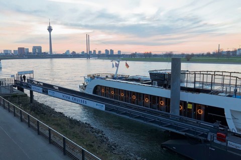 Viva Cruises river cruise ship anchored on Düsseldorf's banks of the Rhine, twilight, Düsseldorf,