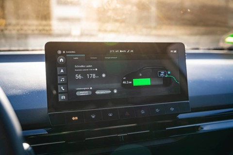 Electronic vehicle instrument shows fast charging information in modern interior, MG4 electric car,