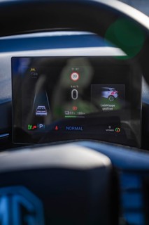 Electronic dashboard shows driving information and battery status in a modern car, MG4 electric