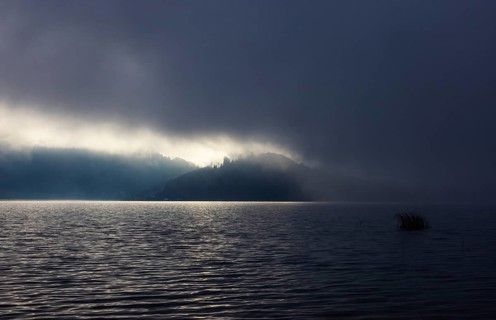 Foggy morning atmosphere with sunrise at the lake, Mondsee, Salzkammergut, Upper Austria, Austria