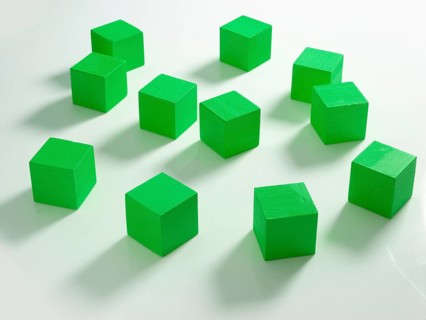 11 green wooden cubes against a white background