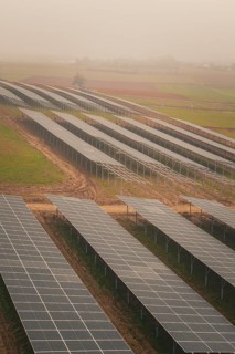 Extensive solar systems on green fields, clear lines and structures, energy revolution,