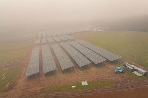 Solar systems in fields in foggy surroundings, distinct structure of solar modules, energy