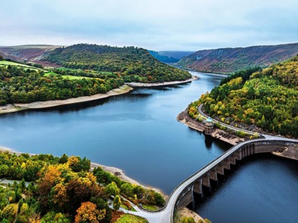 Autumn over Garreg Ddu Dam from a drone, Elan Valley, Caban-Coch Reservoir, Rhayader, Wales, UK