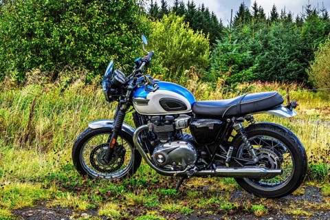 Triumph Motorcycle on the Scottish wilderness, Scotland, United Kingdom