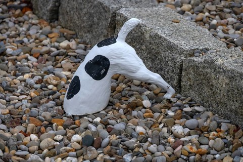 Dog figure with head in a stone bed, Franconia, Bavaria, Germany