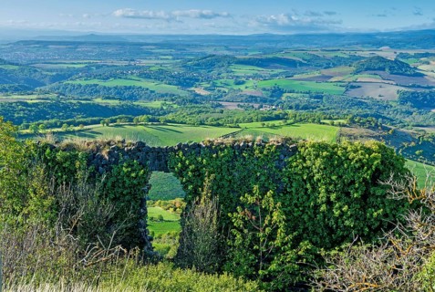 Ruins of medieval castle of Buron on Limagne plain. Puy de Dome. Auvergne Rhone Alpes. France