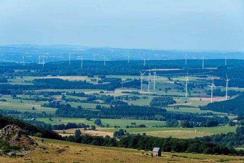 Wind turbines of Combrailles plateau near Bourg-Lastic. Puy de Dome. Auvergne Rhone Alpes. France