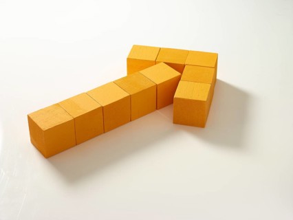 10 yellow wooden cubes against a white background