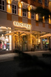 Illuminated shop windows of a clothing store with festive decoration, Nagold, Calw district, Black