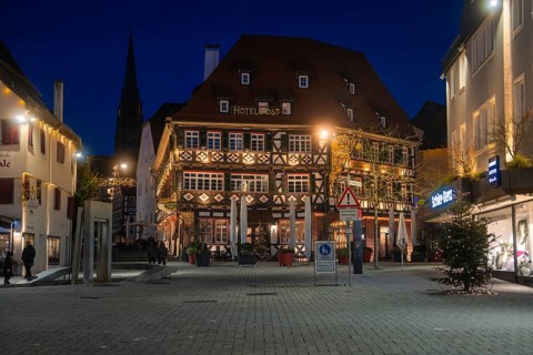 Night view of a traditionally designed half-timbered hotel in the city center, Nagold, Calw