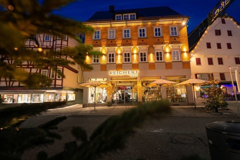 Illuminated facades of a building with Christmas decoration in the city, Nagold, Calw district,
