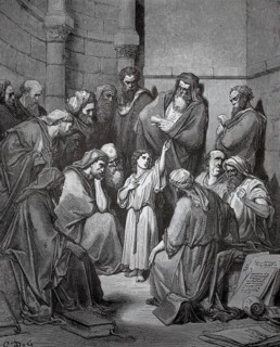 The 12-year-old Jesus in the temple, children and adults gather around a teacher in an ancient room
