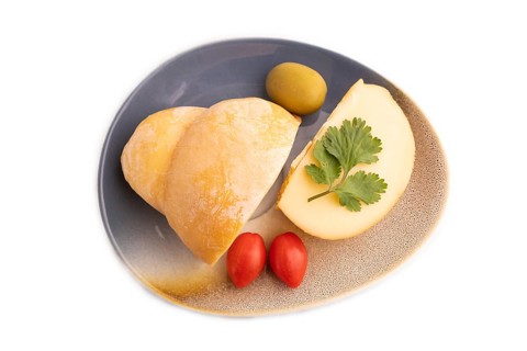 Smoked Mozzarella cheese, with tomatoes and olives isolated on white background, top view, flat