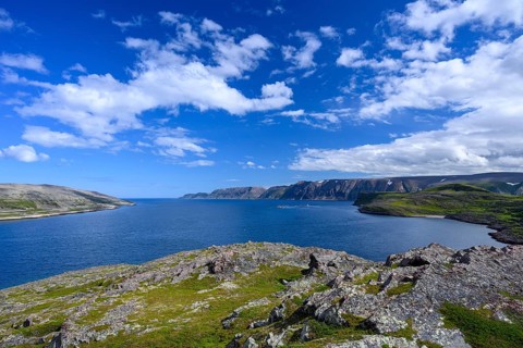 Clear blue sky over rough coastal landscape on Syltefjord with sea, wide landscape with sea and