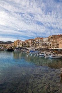 Colourful boats and restaurants in the port of Calvi, Balagne, Haute-Corse department, Corsica,