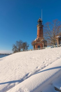 Holtenau lighthouse at the entrance of the Kiel Canal in winter, west bank of the Kiel Fjord,