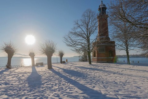 Holtenau lighthouse at the entrance of the Kiel Canal in winter, west bank of the Kiel Fjord,