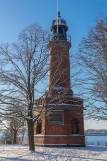 Holtenau lighthouse at the entrance of the Kiel Canal in winter, west bank of the Kiel Fjord,