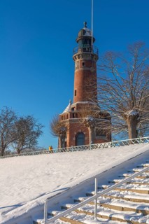 Holtenau lighthouse at the entrance of the Kiel Canal in winter, west bank of the Kiel Fjord,