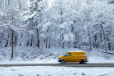 Post bus driving through snowy landscape, trees, winter, snow, Sieversen, Samtgemeinde Rosengarten,