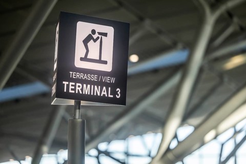 Terminal 3 at Stuttgart Airport. Pictogram viewing terrace. Visitors and aircraft spotters have a